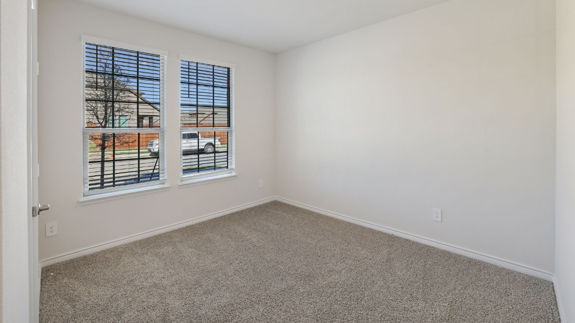 Heading upstairs, discover an open game room that feels full of possibilities—a space for the kids to play, a home gym, or even a second living area. Two additional bedrooms and a full bathroom complete the second floor, offering plenty of room for family or guests.