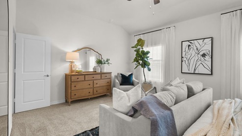 Interior primary bedroom with windows