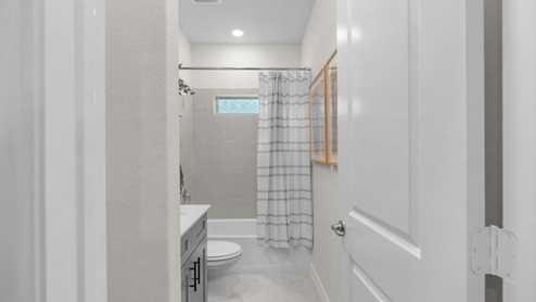 Interior bathroom with double sink and full-sized shower