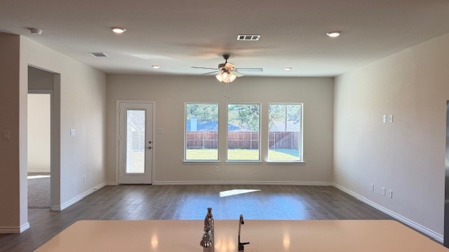 Well-lit living area no furniture