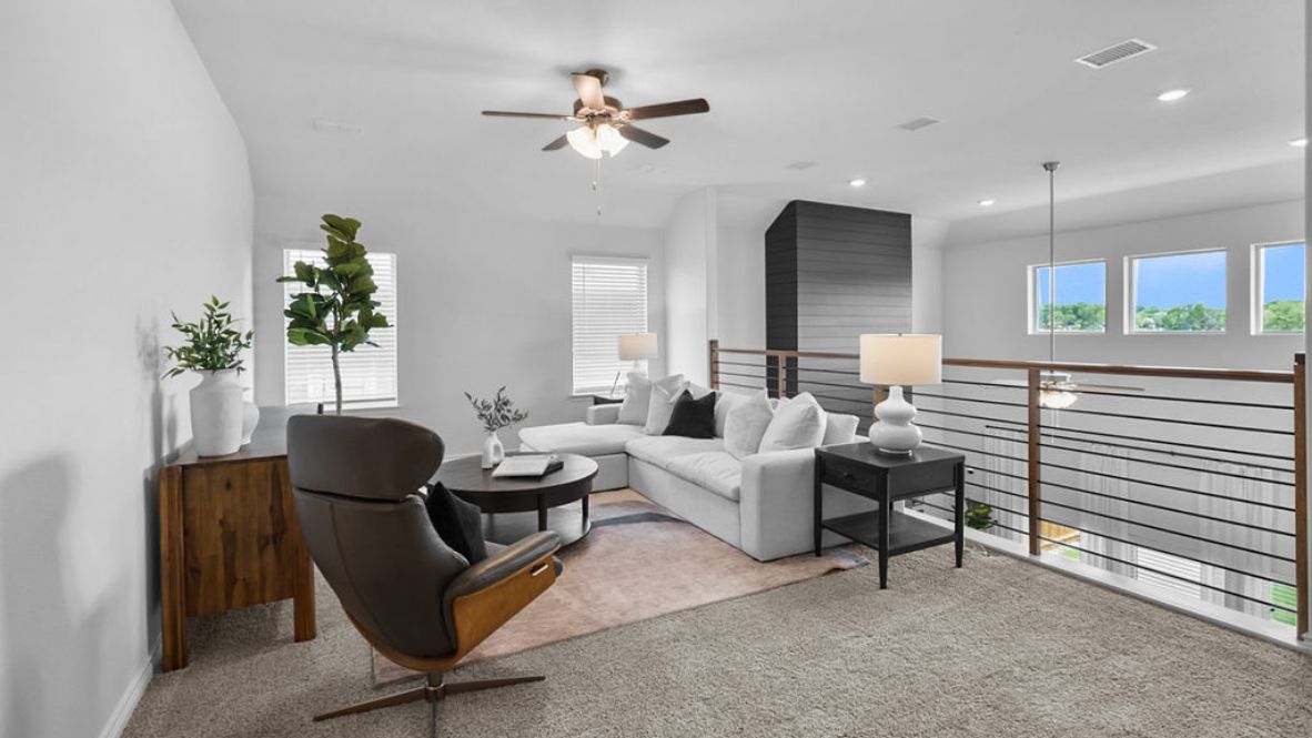 A cozy living room featuring a comfortable couch, a stylish coffee table.