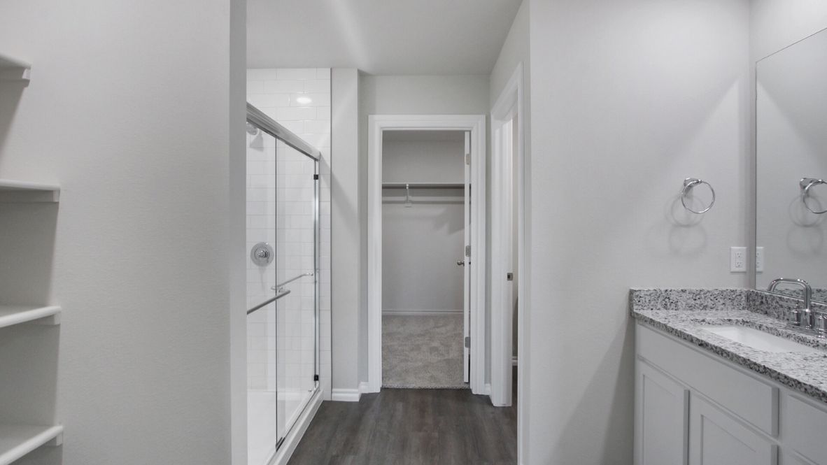 Welcome to the Denton floor plan, where modern charm meets cozy elegance in the heart of The Conrad Village Community, nestled in scenic Bixby, Oklahoma. This one-story haven offers 3 bedrooms, 2 baths, and a generous 1575 square feet of living space, perfect for those seeking a warm and inviting retreat.  From the outside, admire the traditional brick or brick and rock exterior, exuding timeless allure and modern curb appeal. Step inside to discover an open concept layout that effortlessly combines style and functionality. The kitchen features painted white shaker-style cabinets, granite countertops, and stainless steel appliances, creating a welcoming atmosphere that overlooks the dining area and living room, ideal for gatherings and entertaining.  As you explore further, you'll find comfort in every corner. Sink your feet into plush carpeting in the bedrooms, while the main living areas and halls boast durable luxury vinyl wood flooring, adding a touch of rustic charm to your everyday life. Indulge in the luxury of the primary suite, complete with a dual vanity, huge walk-in closet, separate water closet, and a large walk-in shower, ensuring your comfort and convenience.  Experience the convenience of smart home features included in every Denton floor plan. Schedule a tour today and discover your perfect blend of modern luxury and cozy warmth at The Conrad Village Community in Bixby, Oklahoma.