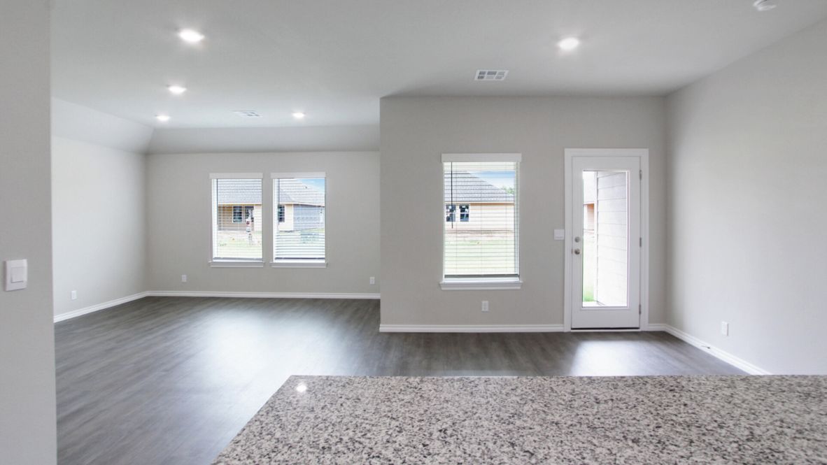 Welcome to the Denton floor plan, where modern charm meets cozy elegance in the heart of The Conrad Village Community, nestled in scenic Bixby, Oklahoma. This one-story haven offers 3 bedrooms, 2 baths, and a generous 1575 square feet of living space, perfect for those seeking a warm and inviting retreat.  From the outside, admire the traditional brick or brick and rock exterior, exuding timeless allure and modern curb appeal. Step inside to discover an open concept layout that effortlessly combines style and functionality. The kitchen features painted white shaker-style cabinets, granite countertops, and stainless steel appliances, creating a welcoming atmosphere that overlooks the dining area and living room, ideal for gatherings and entertaining.  As you explore further, you'll find comfort in every corner. Sink your feet into plush carpeting in the bedrooms, while the main living areas and halls boast durable luxury vinyl wood flooring, adding a touch of rustic charm to your everyday life. Indulge in the luxury of the primary suite, complete with a dual vanity, huge walk-in closet, separate water closet, and a large walk-in shower, ensuring your comfort and convenience.  Experience the convenience of smart home features included in every Denton floor plan. Schedule a tour today and discover your perfect blend of modern luxury and cozy warmth at The Conrad Village Community in Bixby, Oklahoma.