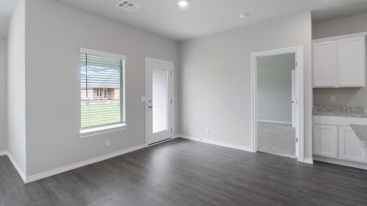 Welcome to the Denton floor plan, where modern charm meets cozy elegance in the heart of The Conrad Village Community, nestled in scenic Bixby, Oklahoma. This one-story haven offers 3 bedrooms, 2 baths, and a generous 1575 square feet of living space, perfect for those seeking a warm and inviting retreat.  From the outside, admire the traditional brick or brick and rock exterior, exuding timeless allure and modern curb appeal. Step inside to discover an open concept layout that effortlessly combines style and functionality. The kitchen features painted white shaker-style cabinets, granite countertops, and stainless steel appliances, creating a welcoming atmosphere that overlooks the dining area and living room, ideal for gatherings and entertaining.  As you explore further, you'll find comfort in every corner. Sink your feet into plush carpeting in the bedrooms, while the main living areas and halls boast durable luxury vinyl wood flooring, adding a touch of rustic charm to your everyday life. Indulge in the luxury of the primary suite, complete with a dual vanity, huge walk-in closet, separate water closet, and a large walk-in shower, ensuring your comfort and convenience.  Experience the convenience of smart home features included in every Denton floor plan. Schedule a tour today and discover your perfect blend of modern luxury and cozy warmth at The Conrad Village Community in Bixby, Oklahoma.