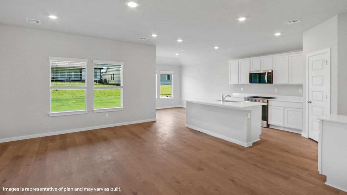 View from dining area to kitchen, outdoor access, living area views Conrad Village