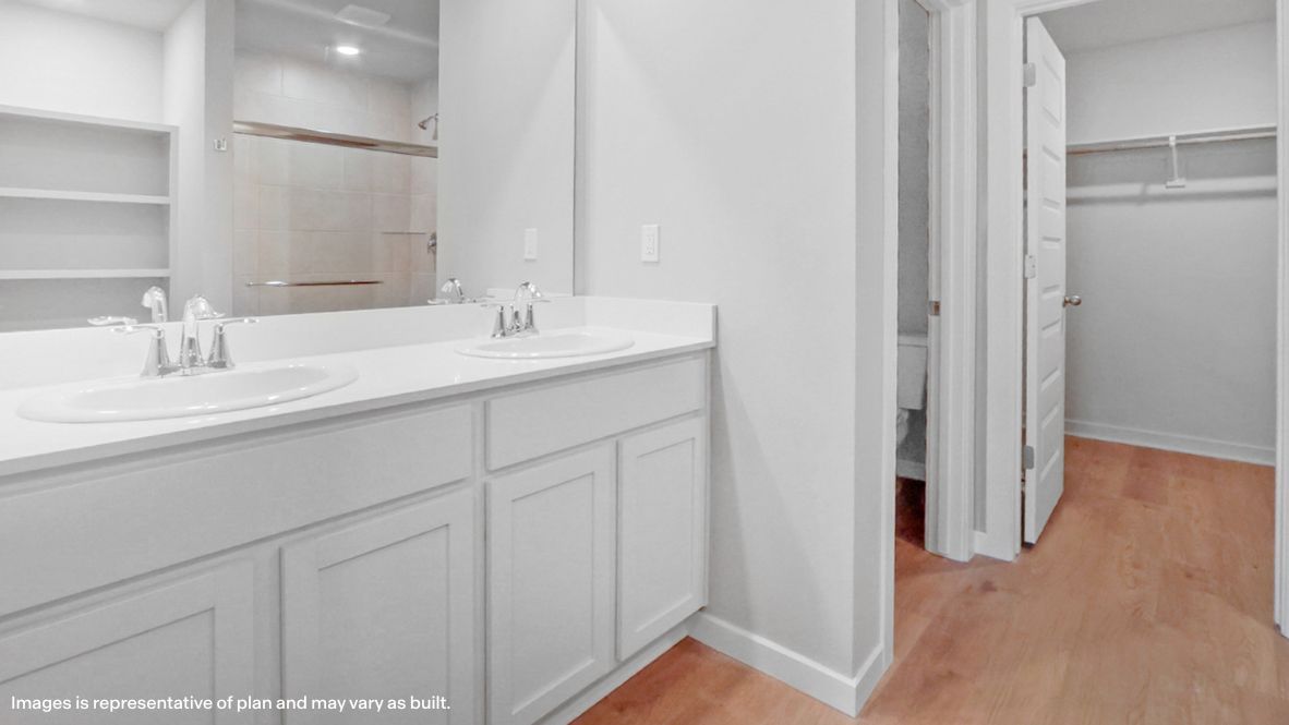 Owner’s ensuite view with vanity and direct connection to the walk-in closet Conrad Village