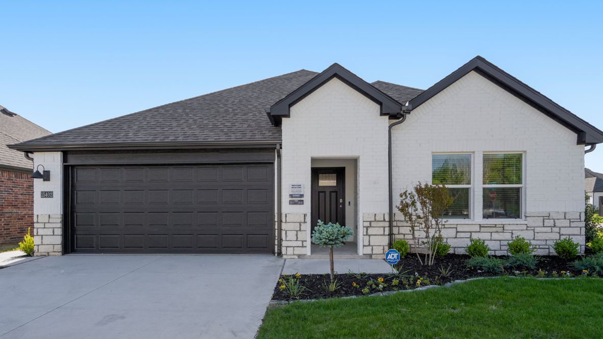 Exterior street view with front yard Conrad Village