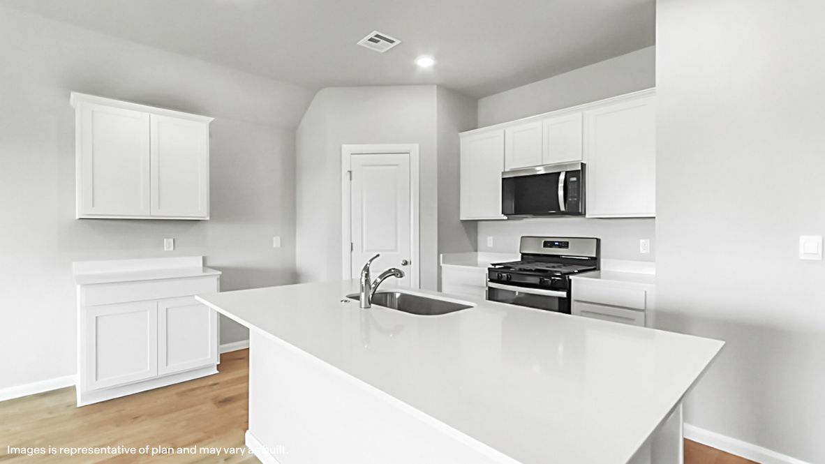 Kitchen including island with sink, new appliance suite included, pantry