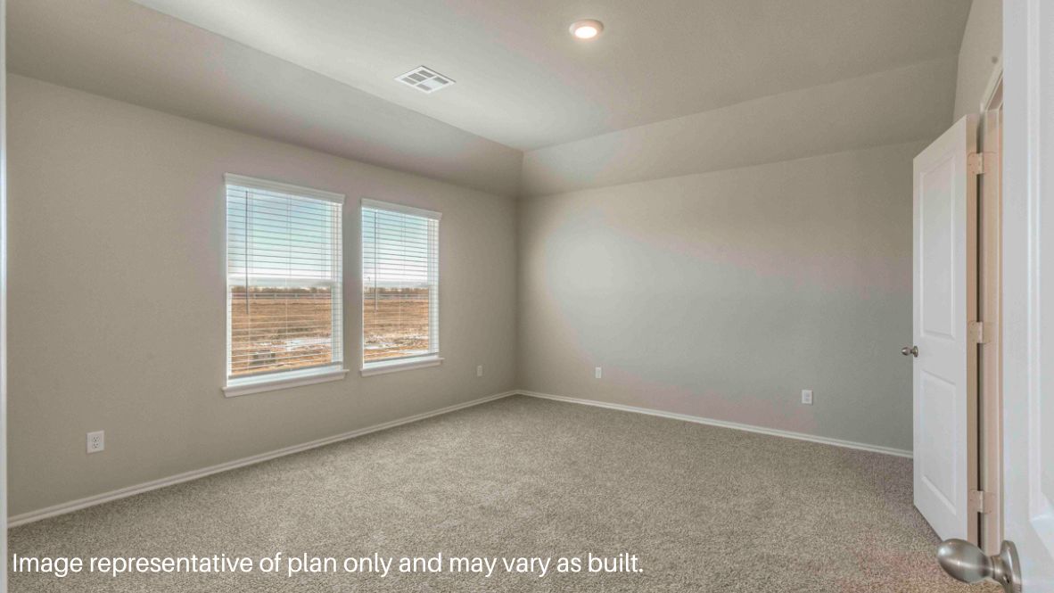 Open-concept living room featuring hardwood floors, large windows for natural light
