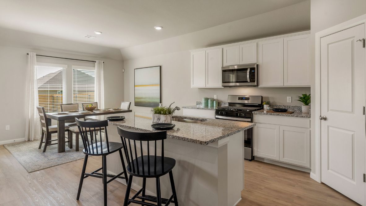 Welcome to Hawks Landing, where the Dean floor plan sets the standard for luxury and comfort in our prestigious new home community. From its grand brick and rock exterior to its professionally landscaped yard adorned with a mature tree in the front, this home boasts curb appeal that leaves a lasting impression.  Step inside to discover an inviting haven adorned with grand ceilings and an abundance of natural light that fills the space. The gourmet kitchen is a chef's dream, featuring white painted shaker style cabinets, granite countertops, and a generously-sized island perfect for hosting holiday gatherings or casual meals with loved ones. Indulge in luxury with luxury vinyl wood-look flooring throughout, offering both durability and timeless appeal. Retreat to the spa-like bathrooms, featuring a lavish walk-in shower with a full glass enclosure and 12x24 timeless marble tile surrounds in all showers.  Enjoy outdoor living to the fullest with a covered patio perfect for relaxing and entertaining. Plus, experience the convenience of smart home features and the sustainability of energy-efficient systems, ensuring your home is both technologically advanced and environmentally friendly.  Don't miss the opportunity to make the Dean floor plan your own. Contact us today and embark on the journey to your dream home in Hawks Landing.