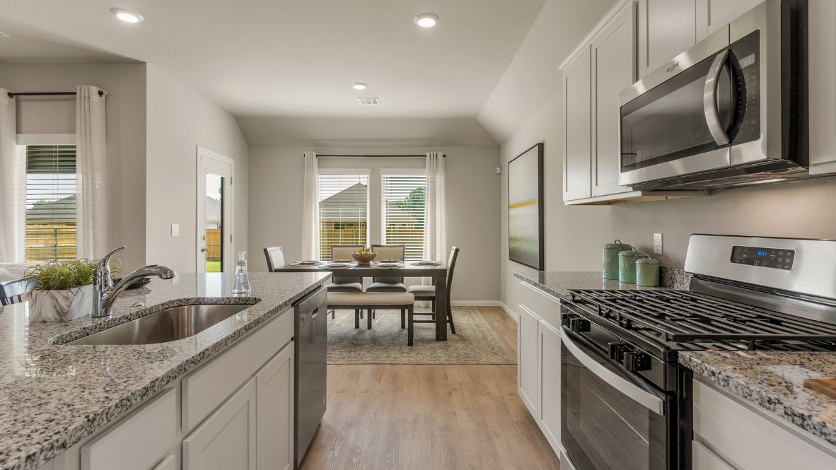 Welcome to Hawks Landing, where the Dean floor plan sets the standard for luxury and comfort in our prestigious new home community. From its grand brick and rock exterior to its professionally landscaped yard adorned with a mature tree in the front, this home boasts curb appeal that leaves a lasting impression.  Step inside to discover an inviting haven adorned with grand ceilings and an abundance of natural light that fills the space. The gourmet kitchen is a chef's dream, featuring white painted shaker style cabinets, granite countertops, and a generously-sized island perfect for hosting holiday gatherings or casual meals with loved ones. Indulge in luxury with luxury vinyl wood-look flooring throughout, offering both durability and timeless appeal. Retreat to the spa-like bathrooms, featuring a lavish walk-in shower with a full glass enclosure and 12x24 timeless marble tile surrounds in all showers.  Enjoy outdoor living to the fullest with a covered patio perfect for relaxing and entertaining. Plus, experience the convenience of smart home features and the sustainability of energy-efficient systems, ensuring your home is both technologically advanced and environmentally friendly.  Don't miss the opportunity to make the Dean floor plan your own. Contact us today and embark on the journey to your dream home in Hawks Landing.