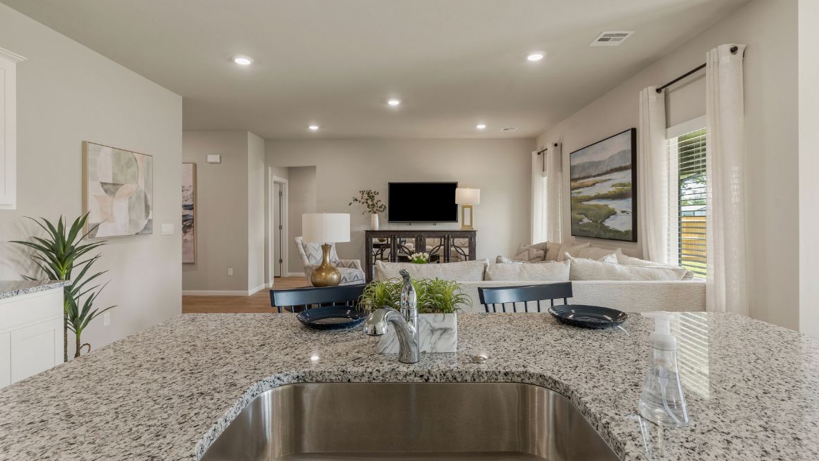 Welcome to Hawks Landing, where the Dean floor plan sets the standard for luxury and comfort in our prestigious new home community. From its grand brick and rock exterior to its professionally landscaped yard adorned with a mature tree in the front, this home boasts curb appeal that leaves a lasting impression.  Step inside to discover an inviting haven adorned with grand ceilings and an abundance of natural light that fills the space. The gourmet kitchen is a chef's dream, featuring white painted shaker style cabinets, granite countertops, and a generously-sized island perfect for hosting holiday gatherings or casual meals with loved ones. Indulge in luxury with luxury vinyl wood-look flooring throughout, offering both durability and timeless appeal. Retreat to the spa-like bathrooms, featuring a lavish walk-in shower with a full glass enclosure and 12x24 timeless marble tile surrounds in all showers.  Enjoy outdoor living to the fullest with a covered patio perfect for relaxing and entertaining. Plus, experience the convenience of smart home features and the sustainability of energy-efficient systems, ensuring your home is both technologically advanced and environmentally friendly.  Don't miss the opportunity to make the Dean floor plan your own. Contact us today and embark on the journey to your dream home in Hawks Landing.