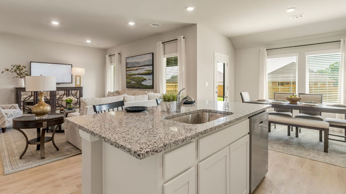 Welcome to Hawks Landing, where the Dean floor plan sets the standard for luxury and comfort in our prestigious new home community. From its grand brick and rock exterior to its professionally landscaped yard adorned with a mature tree in the front, this home boasts curb appeal that leaves a lasting impression.  Step inside to discover an inviting haven adorned with grand ceilings and an abundance of natural light that fills the space. The gourmet kitchen is a chef's dream, featuring white painted shaker style cabinets, granite countertops, and a generously-sized island perfect for hosting holiday gatherings or casual meals with loved ones. Indulge in luxury with luxury vinyl wood-look flooring throughout, offering both durability and timeless appeal. Retreat to the spa-like bathrooms, featuring a lavish walk-in shower with a full glass enclosure and 12x24 timeless marble tile surrounds in all showers.  Enjoy outdoor living to the fullest with a covered patio perfect for relaxing and entertaining. Plus, experience the convenience of smart home features and the sustainability of energy-efficient systems, ensuring your home is both technologically advanced and environmentally friendly.  Don't miss the opportunity to make the Dean floor plan your own. Contact us today and embark on the journey to your dream home in Hawks Landing.