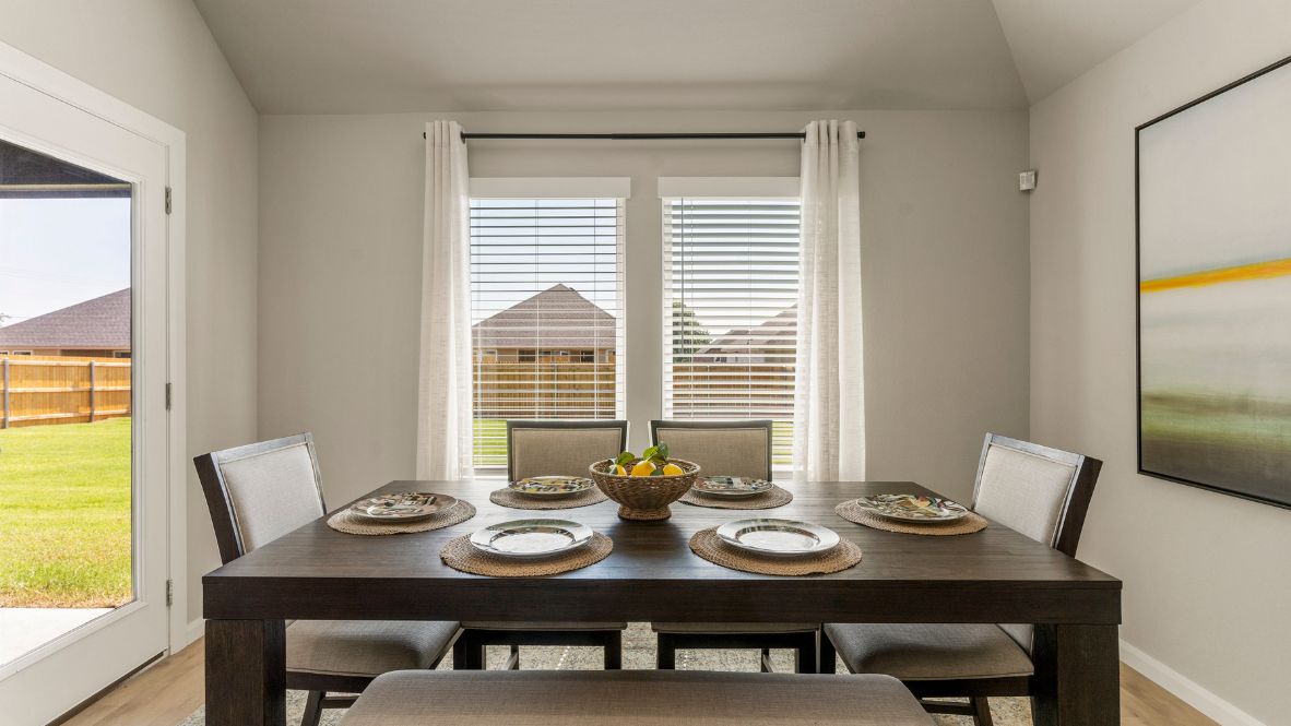 Welcome to Hawks Landing, where the Dean floor plan sets the standard for luxury and comfort in our prestigious new home community. From its grand brick and rock exterior to its professionally landscaped yard adorned with a mature tree in the front, this home boasts curb appeal that leaves a lasting impression.  Step inside to discover an inviting haven adorned with grand ceilings and an abundance of natural light that fills the space. The gourmet kitchen is a chef's dream, featuring white painted shaker style cabinets, granite countertops, and a generously-sized island perfect for hosting holiday gatherings or casual meals with loved ones. Indulge in luxury with luxury vinyl wood-look flooring throughout, offering both durability and timeless appeal. Retreat to the spa-like bathrooms, featuring a lavish walk-in shower with a full glass enclosure and 12x24 timeless marble tile surrounds in all showers.  Enjoy outdoor living to the fullest with a covered patio perfect for relaxing and entertaining. Plus, experience the convenience of smart home features and the sustainability of energy-efficient systems, ensuring your home is both technologically advanced and environmentally friendly.  Don't miss the opportunity to make the Dean floor plan your own. Contact us today and embark on the journey to your dream home in Hawks Landing.