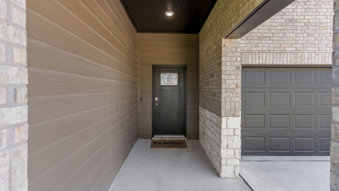 Welcome to Hawks Landing, where the Dean floor plan sets the standard for luxury and comfort in our prestigious new home community. From its grand brick and rock exterior to its professionally landscaped yard adorned with a mature tree in the front, this home boasts curb appeal that leaves a lasting impression.  Step inside to discover an inviting haven adorned with grand ceilings and an abundance of natural light that fills the space. The gourmet kitchen is a chef's dream, featuring white painted shaker style cabinets, granite countertops, and a generously-sized island perfect for hosting holiday gatherings or casual meals with loved ones. Indulge in luxury with luxury vinyl wood-look flooring throughout, offering both durability and timeless appeal. Retreat to the spa-like bathrooms, featuring a lavish walk-in shower with a full glass enclosure and 12x24 timeless marble tile surrounds in all showers.  Enjoy outdoor living to the fullest with a covered patio perfect for relaxing and entertaining. Plus, experience the convenience of smart home features and the sustainability of energy-efficient systems, ensuring your home is both technologically advanced and environmentally friendly.  Don't miss the opportunity to make the Dean floor plan your own. Contact us today and embark on the journey to your dream home in Hawks Landing.