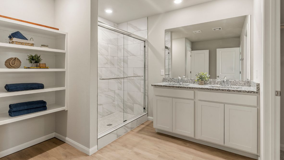 Welcome to Hawks Landing, where the Dean floor plan sets the standard for luxury and comfort in our prestigious new home community. From its grand brick and rock exterior to its professionally landscaped yard adorned with a mature tree in the front, this home boasts curb appeal that leaves a lasting impression.  Step inside to discover an inviting haven adorned with grand ceilings and an abundance of natural light that fills the space. The gourmet kitchen is a chef's dream, featuring white painted shaker style cabinets, granite countertops, and a generously-sized island perfect for hosting holiday gatherings or casual meals with loved ones. Indulge in luxury with luxury vinyl wood-look flooring throughout, offering both durability and timeless appeal. Retreat to the spa-like bathrooms, featuring a lavish walk-in shower with a full glass enclosure and 12x24 timeless marble tile surrounds in all showers.  Enjoy outdoor living to the fullest with a covered patio perfect for relaxing and entertaining. Plus, experience the convenience of smart home features and the sustainability of energy-efficient systems, ensuring your home is both technologically advanced and environmentally friendly.  Don't miss the opportunity to make the Dean floor plan your own. Contact us today and embark on the journey to your dream home in Hawks Landing.