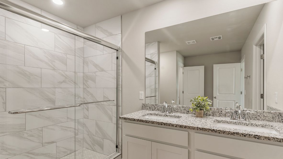 Welcome to Hawks Landing, where the Dean floor plan sets the standard for luxury and comfort in our prestigious new home community. From its grand brick and rock exterior to its professionally landscaped yard adorned with a mature tree in the front, this home boasts curb appeal that leaves a lasting impression.  Step inside to discover an inviting haven adorned with grand ceilings and an abundance of natural light that fills the space. The gourmet kitchen is a chef's dream, featuring white painted shaker style cabinets, granite countertops, and a generously-sized island perfect for hosting holiday gatherings or casual meals with loved ones. Indulge in luxury with luxury vinyl wood-look flooring throughout, offering both durability and timeless appeal. Retreat to the spa-like bathrooms, featuring a lavish walk-in shower with a full glass enclosure and 12x24 timeless marble tile surrounds in all showers.  Enjoy outdoor living to the fullest with a covered patio perfect for relaxing and entertaining. Plus, experience the convenience of smart home features and the sustainability of energy-efficient systems, ensuring your home is both technologically advanced and environmentally friendly.  Don't miss the opportunity to make the Dean floor plan your own. Contact us today and embark on the journey to your dream home in Hawks Landing.