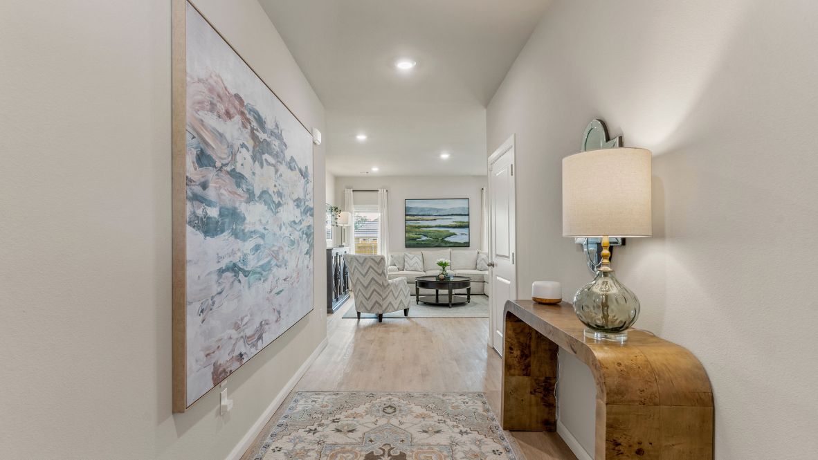 Welcome to Hawks Landing, where the Dean floor plan sets the standard for luxury and comfort in our prestigious new home community. From its grand brick and rock exterior to its professionally landscaped yard adorned with a mature tree in the front, this home boasts curb appeal that leaves a lasting impression.  Step inside to discover an inviting haven adorned with grand ceilings and an abundance of natural light that fills the space. The gourmet kitchen is a chef's dream, featuring white painted shaker style cabinets, granite countertops, and a generously-sized island perfect for hosting holiday gatherings or casual meals with loved ones. Indulge in luxury with luxury vinyl wood-look flooring throughout, offering both durability and timeless appeal. Retreat to the spa-like bathrooms, featuring a lavish walk-in shower with a full glass enclosure and 12x24 timeless marble tile surrounds in all showers.  Enjoy outdoor living to the fullest with a covered patio perfect for relaxing and entertaining. Plus, experience the convenience of smart home features and the sustainability of energy-efficient systems, ensuring your home is both technologically advanced and environmentally friendly.  Don't miss the opportunity to make the Dean floor plan your own. Contact us today and embark on the journey to your dream home in Hawks Landing.