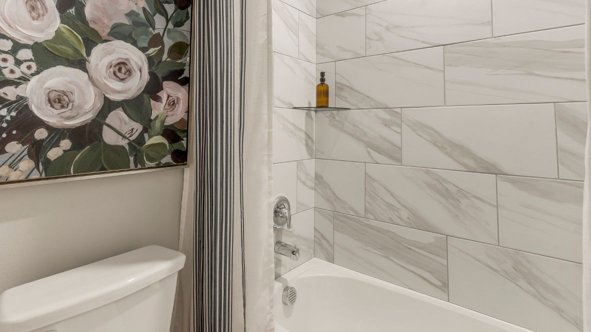 Welcome to Hawks Landing, where the Dean floor plan sets the standard for luxury and comfort in our prestigious new home community. From its grand brick and rock exterior to its professionally landscaped yard adorned with a mature tree in the front, this home boasts curb appeal that leaves a lasting impression.  Step inside to discover an inviting haven adorned with grand ceilings and an abundance of natural light that fills the space. The gourmet kitchen is a chef's dream, featuring white painted shaker style cabinets, granite countertops, and a generously-sized island perfect for hosting holiday gatherings or casual meals with loved ones. Indulge in luxury with luxury vinyl wood-look flooring throughout, offering both durability and timeless appeal. Retreat to the spa-like bathrooms, featuring a lavish walk-in shower with a full glass enclosure and 12x24 timeless marble tile surrounds in all showers.  Enjoy outdoor living to the fullest with a covered patio perfect for relaxing and entertaining. Plus, experience the convenience of smart home features and the sustainability of energy-efficient systems, ensuring your home is both technologically advanced and environmentally friendly.  Don't miss the opportunity to make the Dean floor plan your own. Contact us today and embark on the journey to your dream home in Hawks Landing.