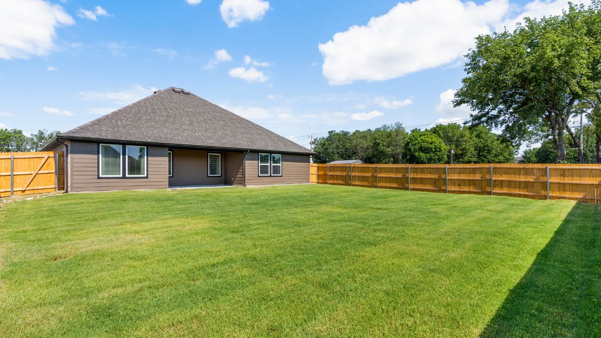 Welcome to Hawks Landing, where the Dean floor plan sets the standard for luxury and comfort in our prestigious new home community. From its grand brick and rock exterior to its professionally landscaped yard adorned with a mature tree in the front, this home boasts curb appeal that leaves a lasting impression.  Step inside to discover an inviting haven adorned with grand ceilings and an abundance of natural light that fills the space. The gourmet kitchen is a chef's dream, featuring white painted shaker style cabinets, granite countertops, and a generously-sized island perfect for hosting holiday gatherings or casual meals with loved ones. Indulge in luxury with luxury vinyl wood-look flooring throughout, offering both durability and timeless appeal. Retreat to the spa-like bathrooms, featuring a lavish walk-in shower with a full glass enclosure and 12x24 timeless marble tile surrounds in all showers.  Enjoy outdoor living to the fullest with a covered patio perfect for relaxing and entertaining. Plus, experience the convenience of smart home features and the sustainability of energy-efficient systems, ensuring your home is both technologically advanced and environmentally friendly.  Don't miss the opportunity to make the Dean floor plan your own. Contact us today and embark on the journey to your dream home in Hawks Landing.