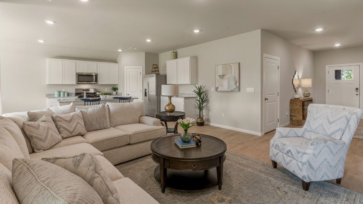 Welcome to Hawks Landing, where the Dean floor plan sets the standard for luxury and comfort in our prestigious new home community. From its grand brick and rock exterior to its professionally landscaped yard adorned with a mature tree in the front, this home boasts curb appeal that leaves a lasting impression.  Step inside to discover an inviting haven adorned with grand ceilings and an abundance of natural light that fills the space. The gourmet kitchen is a chef's dream, featuring white painted shaker style cabinets, granite countertops, and a generously-sized island perfect for hosting holiday gatherings or casual meals with loved ones. Indulge in luxury with luxury vinyl wood-look flooring throughout, offering both durability and timeless appeal. Retreat to the spa-like bathrooms, featuring a lavish walk-in shower with a full glass enclosure and 12x24 timeless marble tile surrounds in all showers.  Enjoy outdoor living to the fullest with a covered patio perfect for relaxing and entertaining. Plus, experience the convenience of smart home features and the sustainability of energy-efficient systems, ensuring your home is both technologically advanced and environmentally friendly.  Don't miss the opportunity to make the Dean floor plan your own. Contact us today and embark on the journey to your dream home in Hawks Landing.