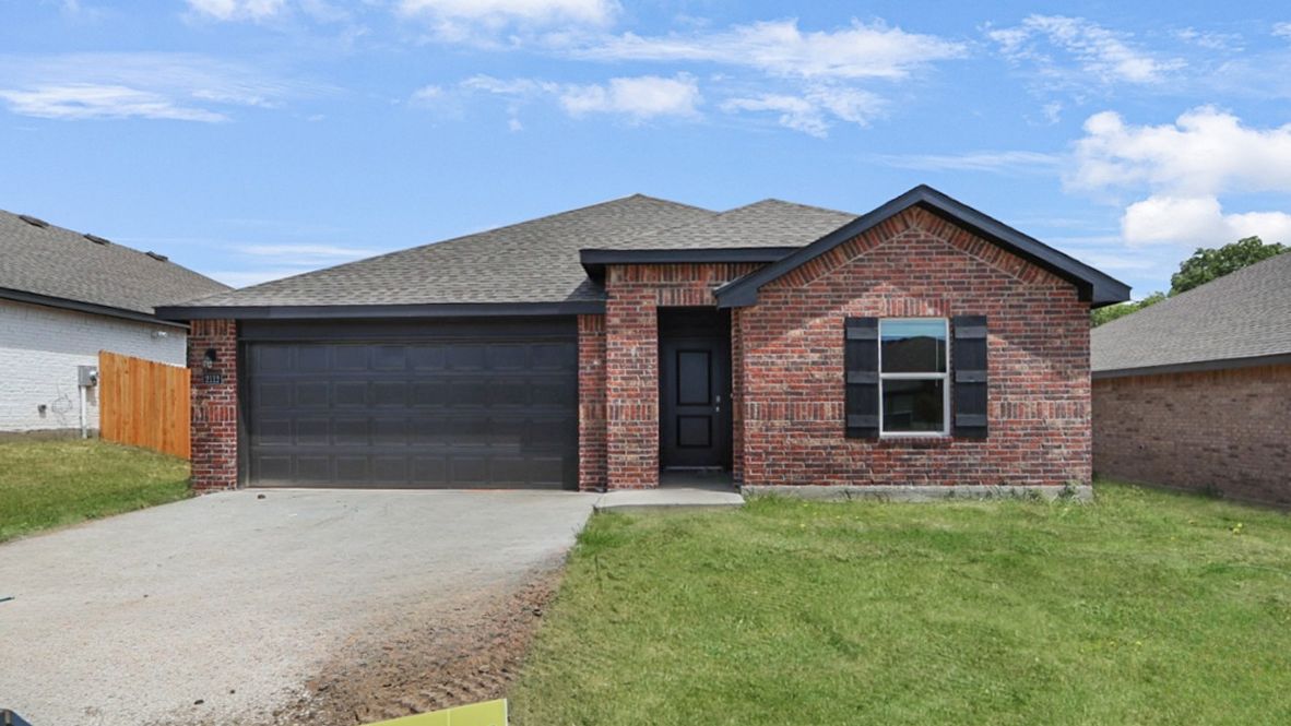 Sidewalk view highlighting façade, entry path, and front yard