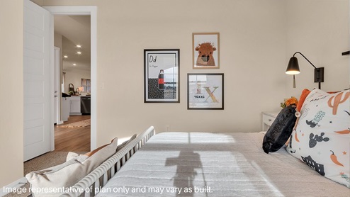 A vibrant kids' bedroom showcasing a neatly made bed, a stylish dresser, and a playful painting that adds charm.