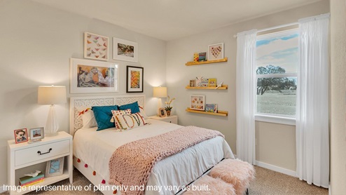 A vibrant kids' bedroom showcasing a neatly made bed, a stylish dresser, and a playful painting that adds charm.