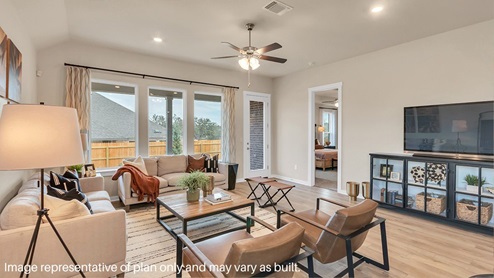 Spacious dining area with vinyl wood flooring, large window and tall ceiling.
