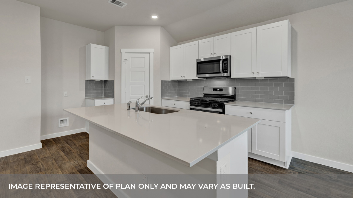 Contemporary kitchen adorned with white cabinets seamlessly integrated into an open dining area layout.