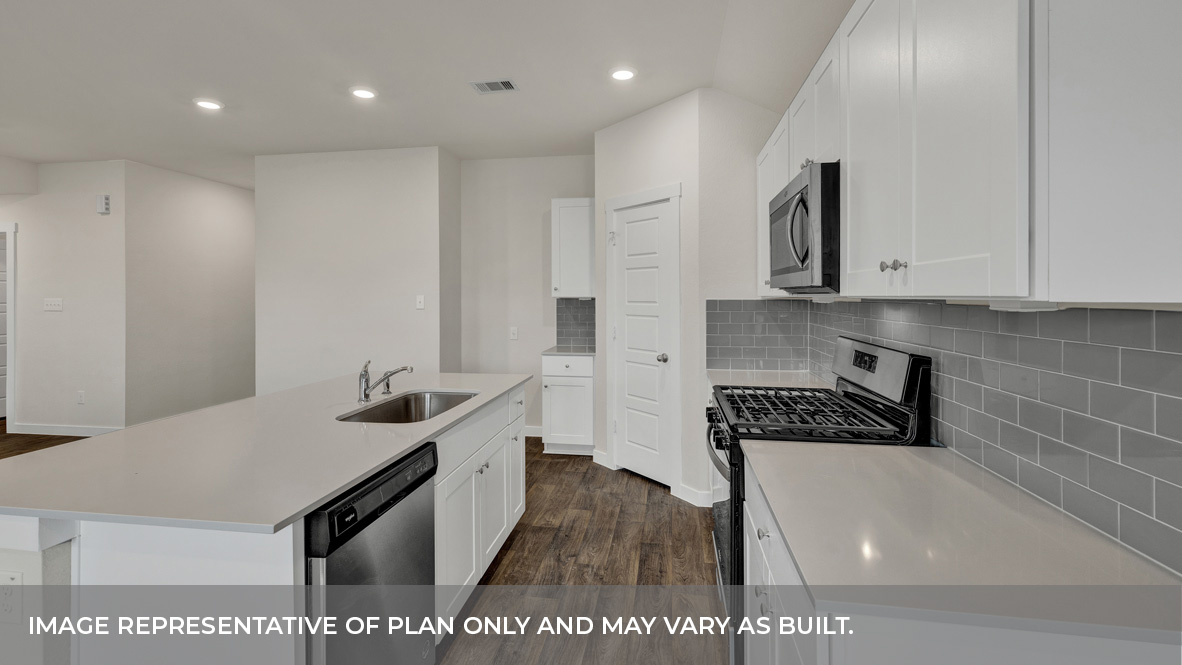 Contemporary kitchen adorned with white cabinets seamlessly integrated into an open dining area layout.