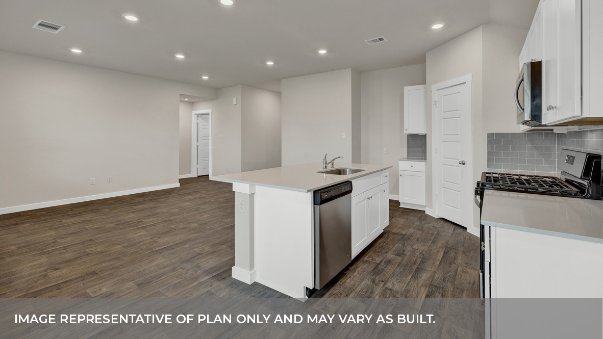 Contemporary kitchen adorned with white cabinets seamlessly integrated into an open dining area layout.