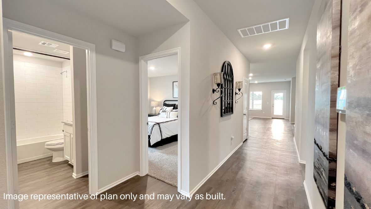 Bright and spacious kitchen with granite countertops, stainless steel appliances, and an island with bar seating.