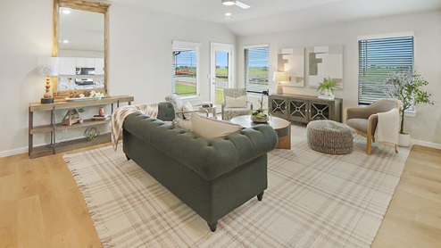Interior of living room with large windows and back door