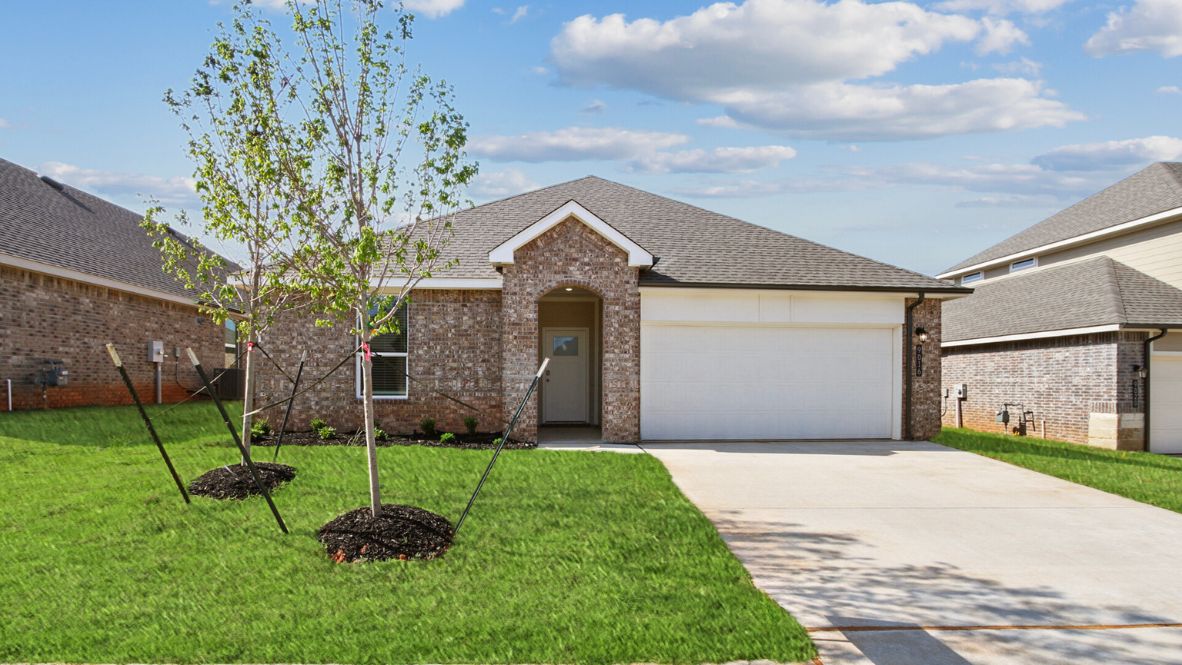 Sidewalk view showing front elevation, lawn, and architectural style Justin plan