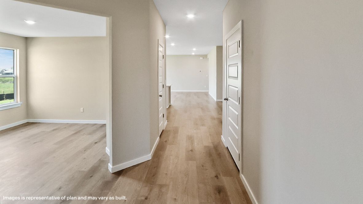 Entry hallway leading to living room and kitchen in the background.