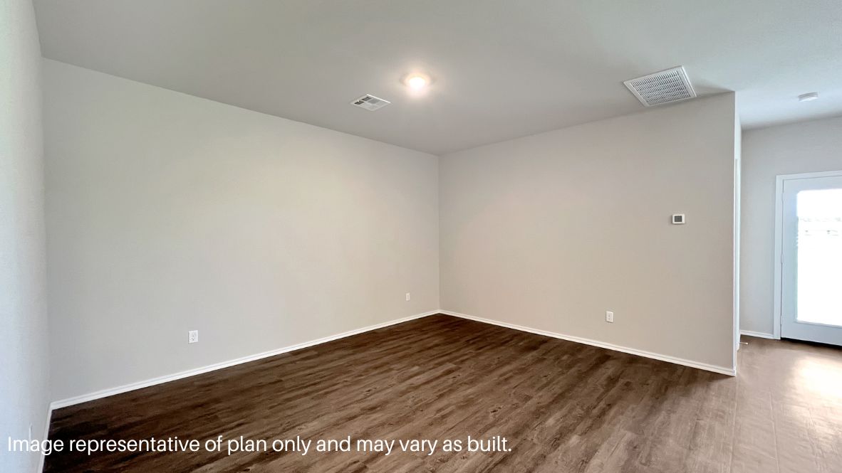 Spacious dining area with vinyl wood flooring, large window and tall ceiling.