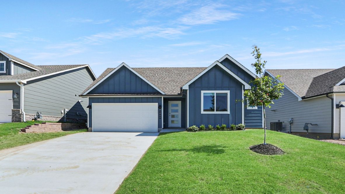 Neighborhood street view of the Fargo Plan by D.R. Horton with crafty front elevation