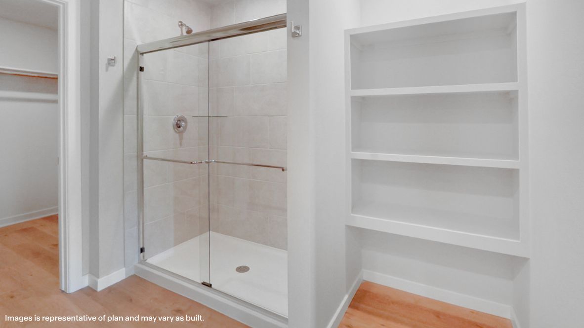 Owner's ensuite, dual vanity sinks, walk-in closet view