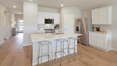 Interior of white kitchen with central island