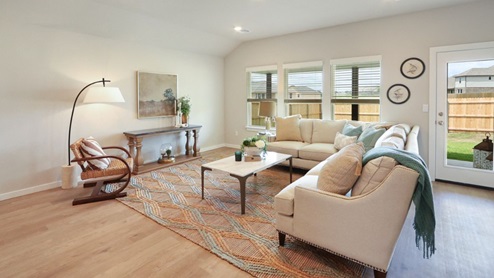Interior of living room with large windows and back door