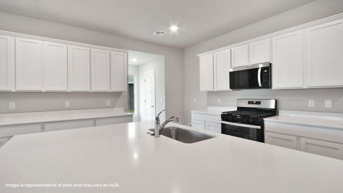 Central kitchen island designed for seating, sink, storage, and daily prep Rowan Grove