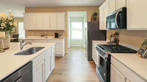 Interior kitchen with white cabinets and counter tops