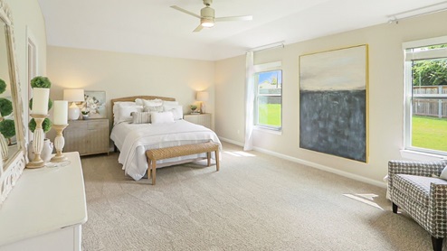 Interior bedroom with two large windows
