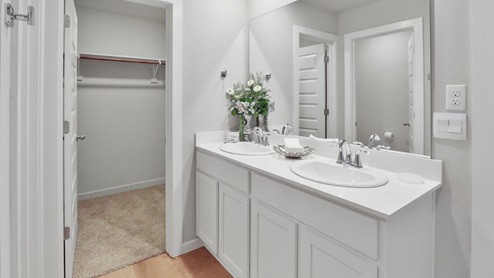 Interior bathroom with double sinks and private bathroom