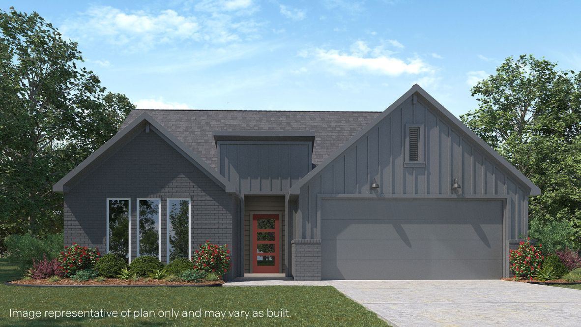 Newly built single story brick home with modern architecture, a double garage, and landscaped front yard.