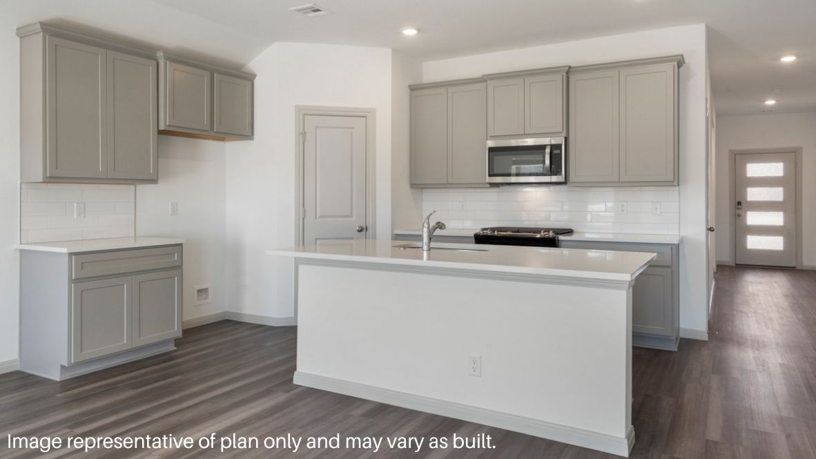 Entry hallway leading to living room and kitchen in the background.