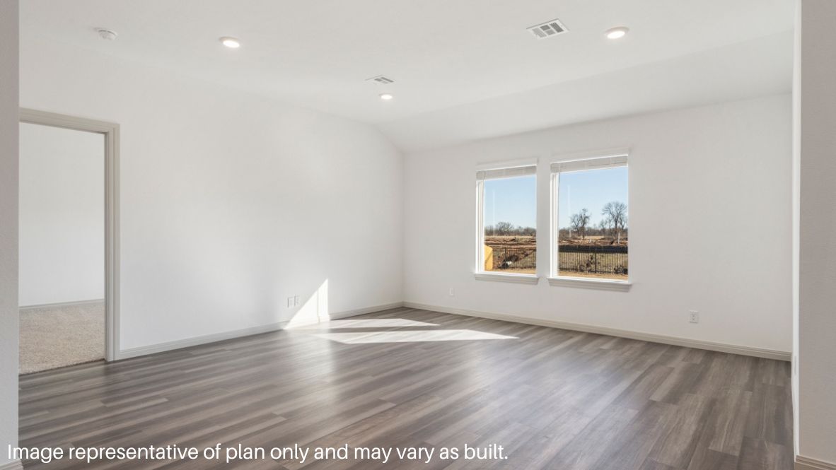 A well-organized living room that includes a kitchen and dining area, creating a warm and welcoming environment for gatherings.