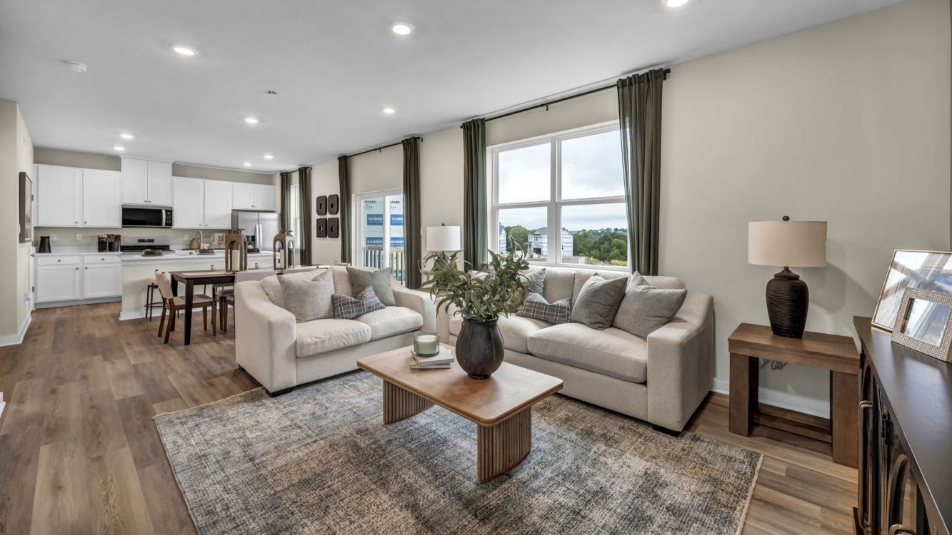 Living room with 9 foot ceilings and trendy LVP flooring