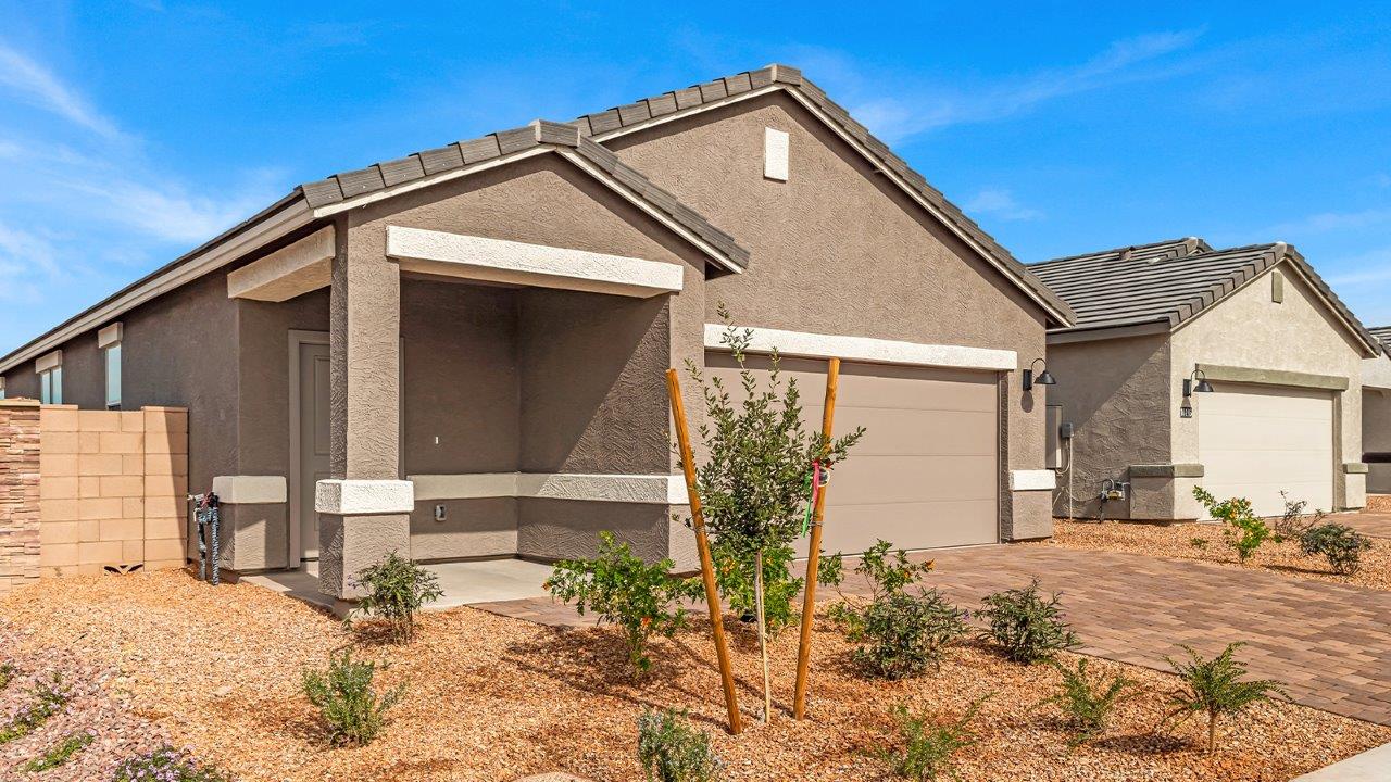 Discover new homes within the only gated community in Gladden Farms. Coronet at Gladden Farms, a premier D.R. Horton community where modern living meets the scenic charm of Marana, Arizona. Coronet offers residents the perfect blend of small-town warmth and modern amenities. Surrounded by 830 acres of green space, 28 parks, and 19 playgrounds, this gated community is designed for families who value both comfort and outdoor adventure.  Residents of Coronet at Gladden Farms enjoy exclusive amenities such as a sparkling community pool, jacuzzi, fitness center, and a clubhouse complete with a BBQ area and patio. The community also offers walking trails, a dog park, and playgrounds, making it the ideal environment for families and active lifestyles. Each home is thoughtfully designed with high-end finishes, including quartz countertops, wood-look luxury vinyl plank flooring, tile roofs, Spanish Lace stucco exteriors and beautifully landscaped front yards with auto drip irrigation. Additionally, all homes feature covered front porches and back patios, perfect for enjoying the stunning Arizona sunsets and monsoons.  Coronet at Gladden Farms is built with a commitment to energy efficiency and sustainability. Each home meets the DOE Zero Energy Ready Home standards, meaning they are constructed to be so energy-efficient that a renewable energy system could offset most or all of the home's annual energy use. These homes include advanced features such as tankless water heaters, energy-efficient LED lighting, and high-performance insulation, ensuring lower utility costs and a reduced environmental footprint. The Home is Connected Smart Home package, which includes a smart thermostat, video doorbell, keyless entry, a Wi-Fi-enabled garage door opener, and much more, provides modern convenience and enhanced security.  Living in Coronet at Gladden Farms means being part of a thriving community with easy access to shopping, dining, and recreation. The greater Gladden Farms area is equipped with amenities like a splashpad, soccer fields, and the Paws & Claws Dog Park. Families will appreciate being part of the Marana Unified School District, with Gladden Farms Elementary nearby and a new K-8 school opening in 2025.  Beyond the community, residents can explore the natural beauty of the area with proximity to Picacho Peak State Park, Tortolita Mountain Park, and Saguaro National Park, offering endless opportunities for hiking, cycling, and wildlife viewing. Experience the perfect blend of comfort, convenience, and community at Coronet at Gladden Farms—where new homes, energy efficiency, and a vibrant lifestyle await.